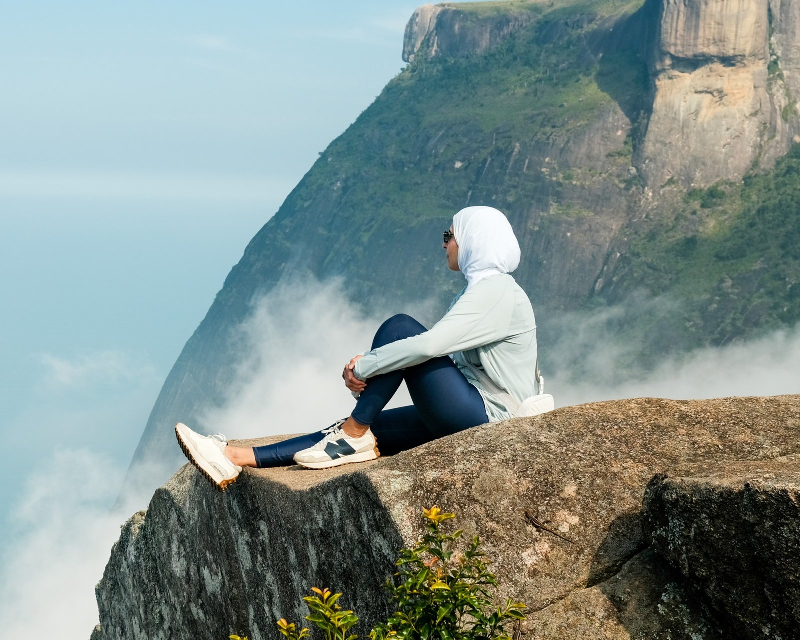 Woman writing notes by the water